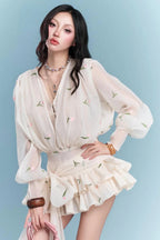 Amelia Embroidered Floral V-neck Ruffle Mini Dress in Apricot Avalabel