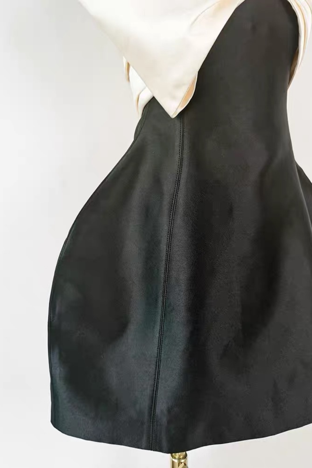 Black Sleeveless Mini Dress with Statement Bow and Structured Skirt Avalabel