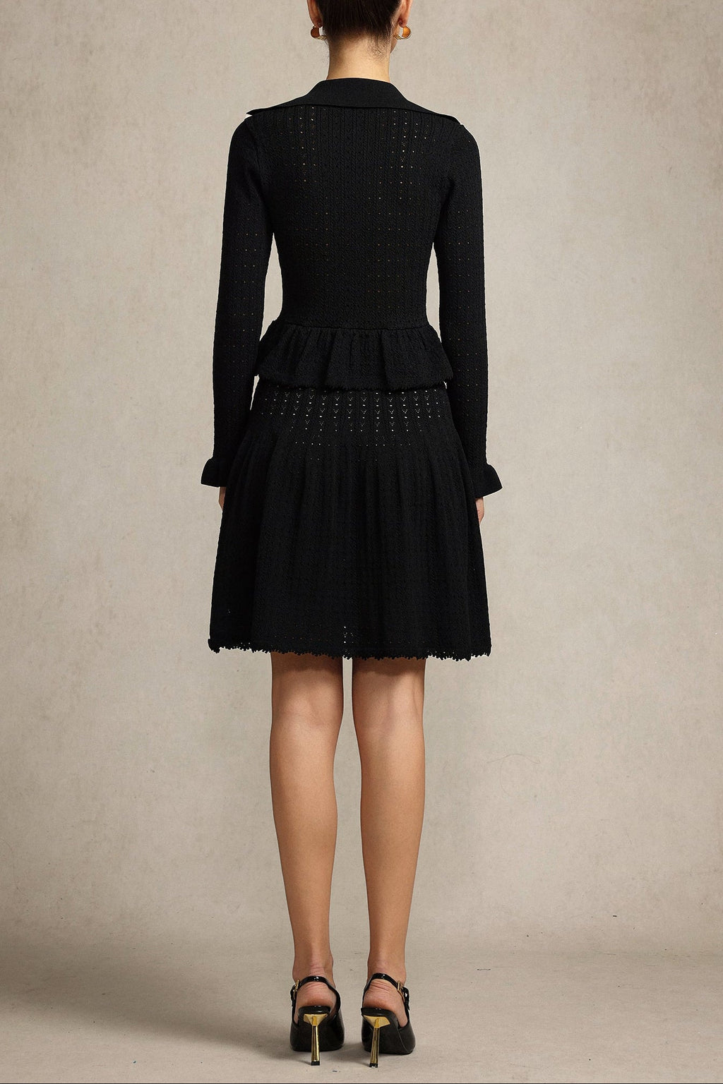 Leaf-edge paneled V-neck knitted mini dress in black Avalabel