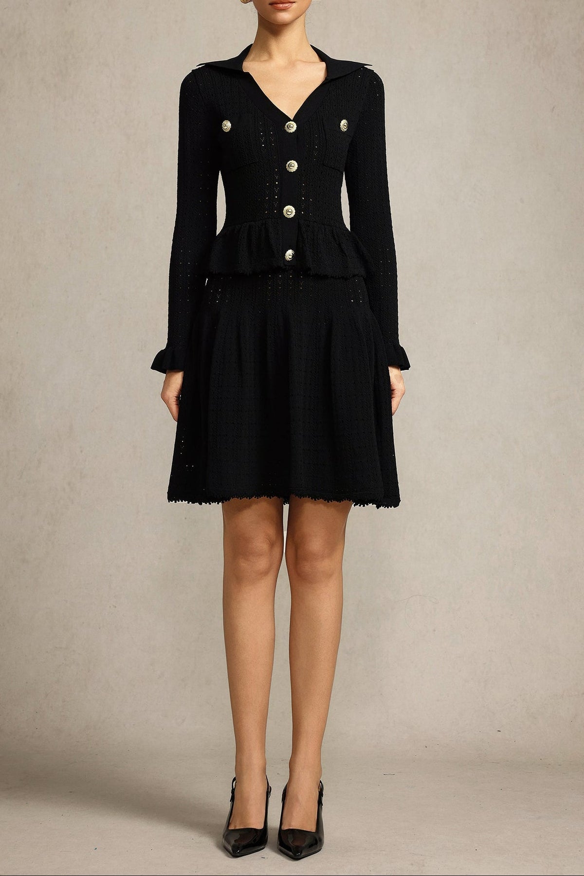 Leaf-edge paneled V-neck knitted mini dress in black Avalabel