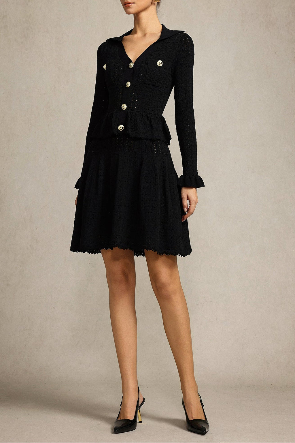 Leaf-edge paneled V-neck knitted mini dress in black Avalabel