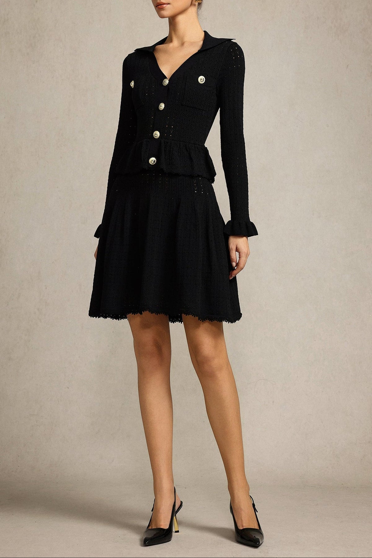Leaf-edge paneled V-neck knitted mini dress in black Avalabel