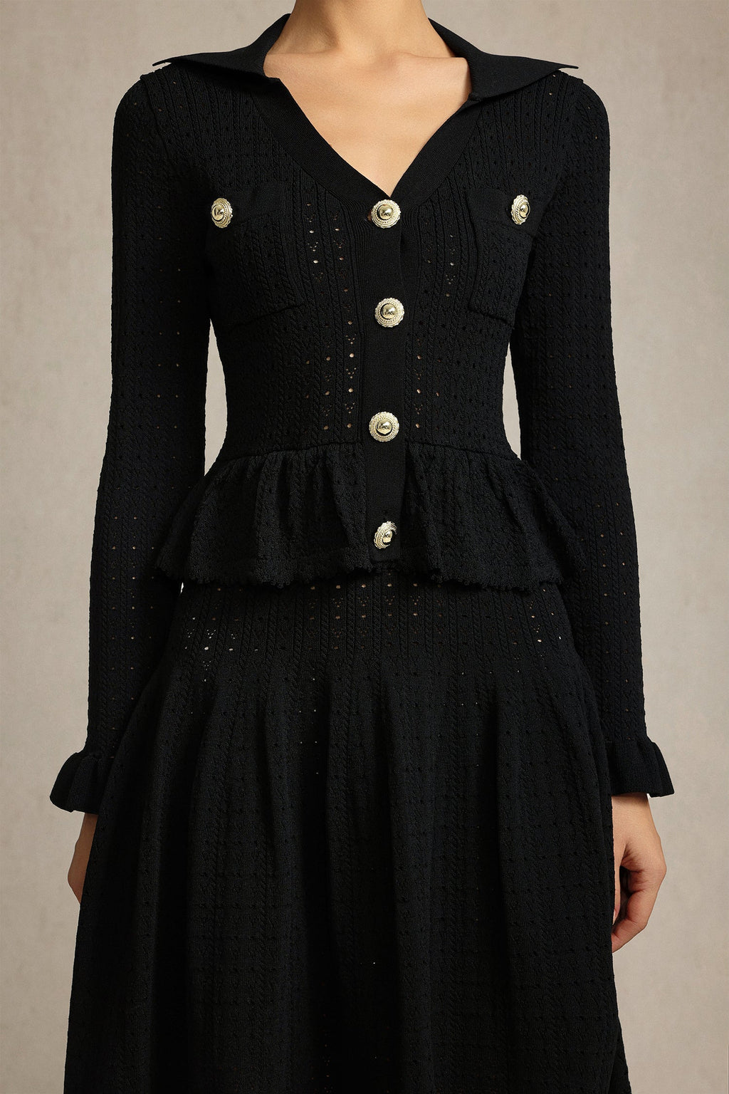 Leaf-edge paneled V-neck knitted mini dress in black Avalabel