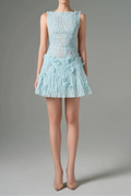 Light blue dress with floral details on a gray background