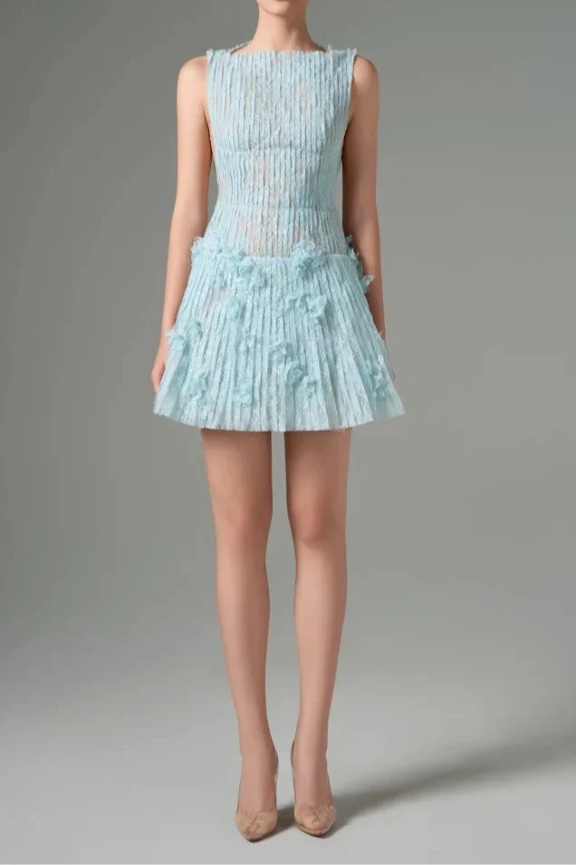 Light blue dress with floral details on a gray background
