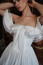 Alison Off-Shoulder Bow Lace Mini Dress in White Avalabel