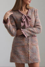 xylia bow v-neck long sleeve mini dress in multicolor Avalabel
