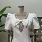 V-Neck Diamond Chain Bow Mini Dress in Ivory Avalabel