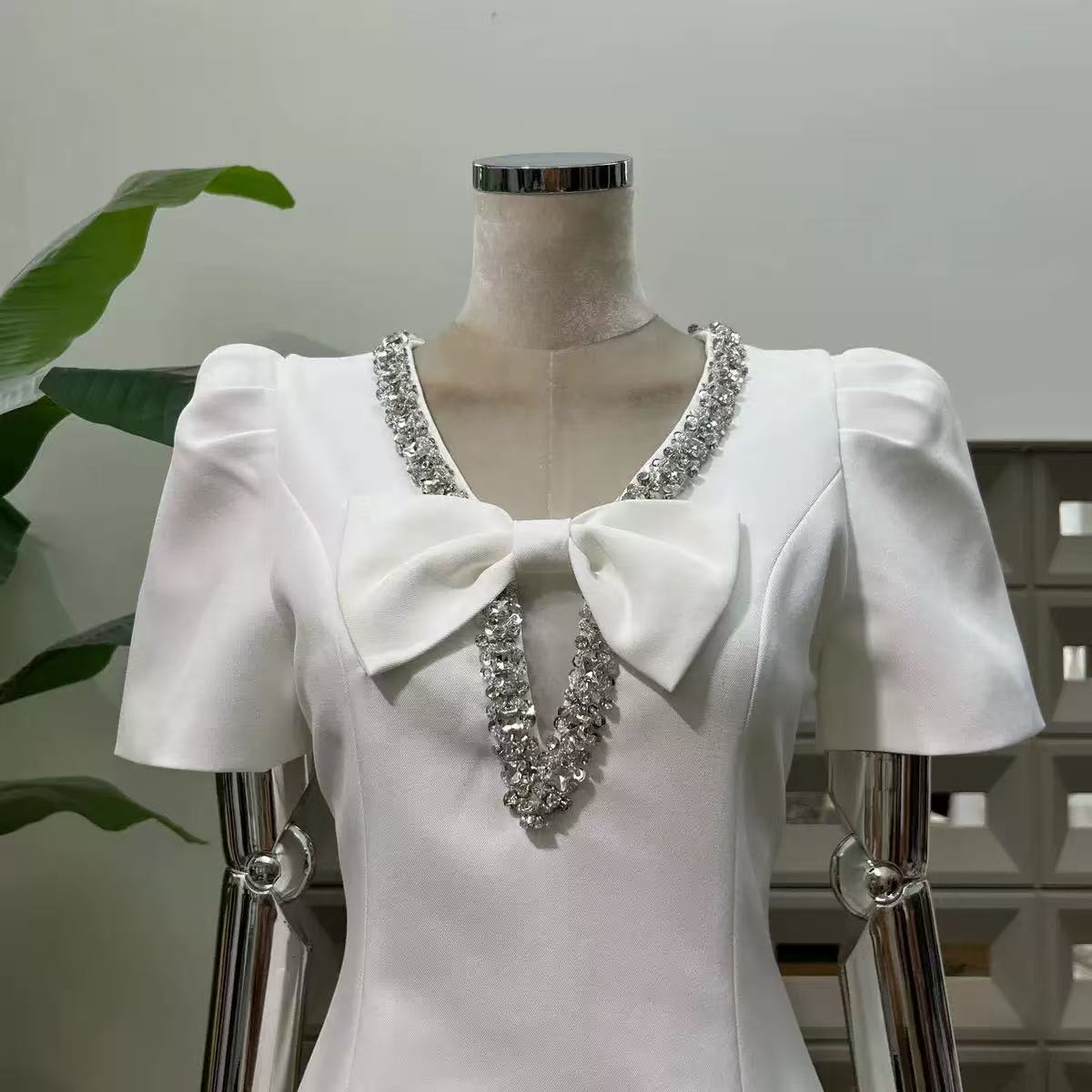 V-Neck Diamond Chain Bow Mini Dress in Ivory Avalabel