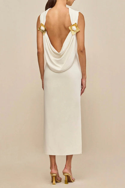 white sleeveless backless knit midi dress with two pleated golden embellishments