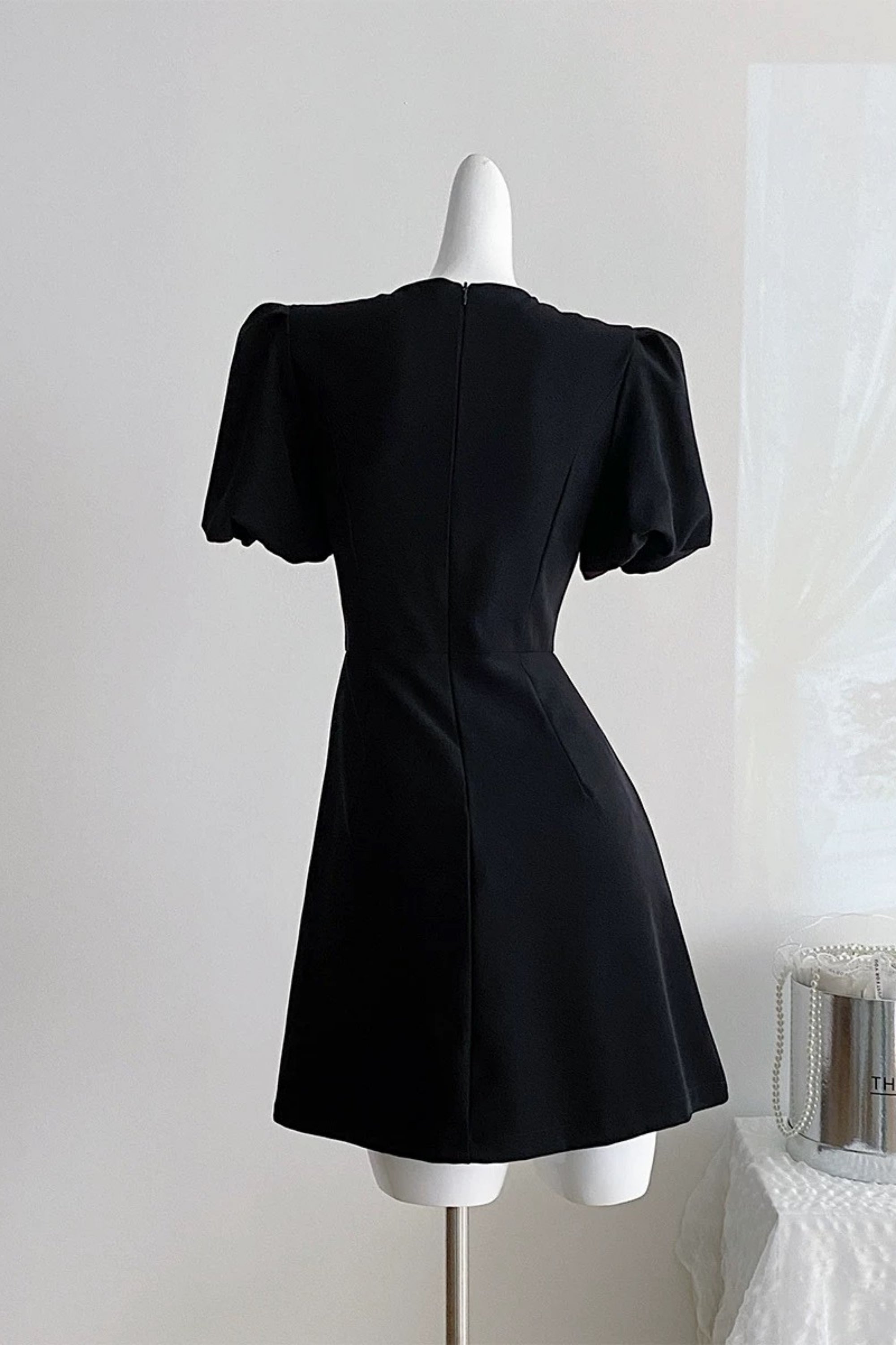 Vanessa Bow Puff Sleeve Mini Dress in Black Avalabel