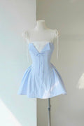 Light blue striped dress on a mannequin against a white wall