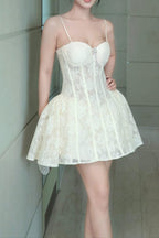 Woman in a white lace dress standing in a tiled hallway
