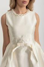 Elegant Fitted Dress With Pearl-Embellished Round Neckline And Bow Waistline Accent - Ivoire Avalabel