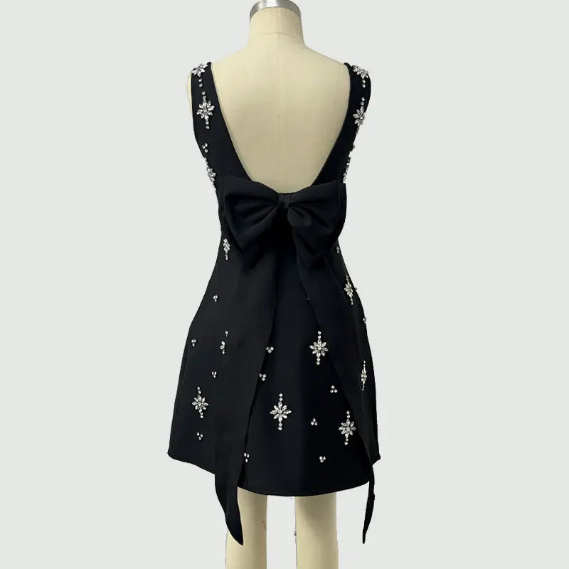 adora Sleeveless Diamond Bow Bandage Mini Dress in black Avalabel