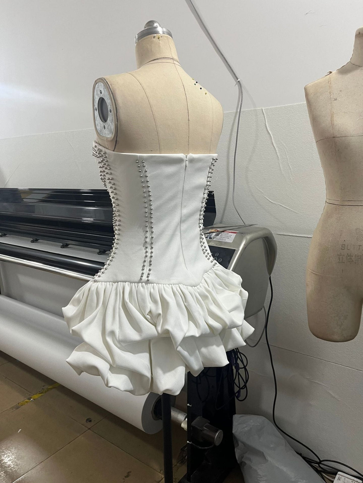 regina strapless puffy mini dress in off-white Avalabel