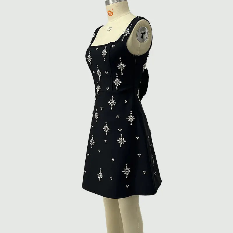 adora Sleeveless Diamond Bow Bandage Mini Dress in black Avalabel