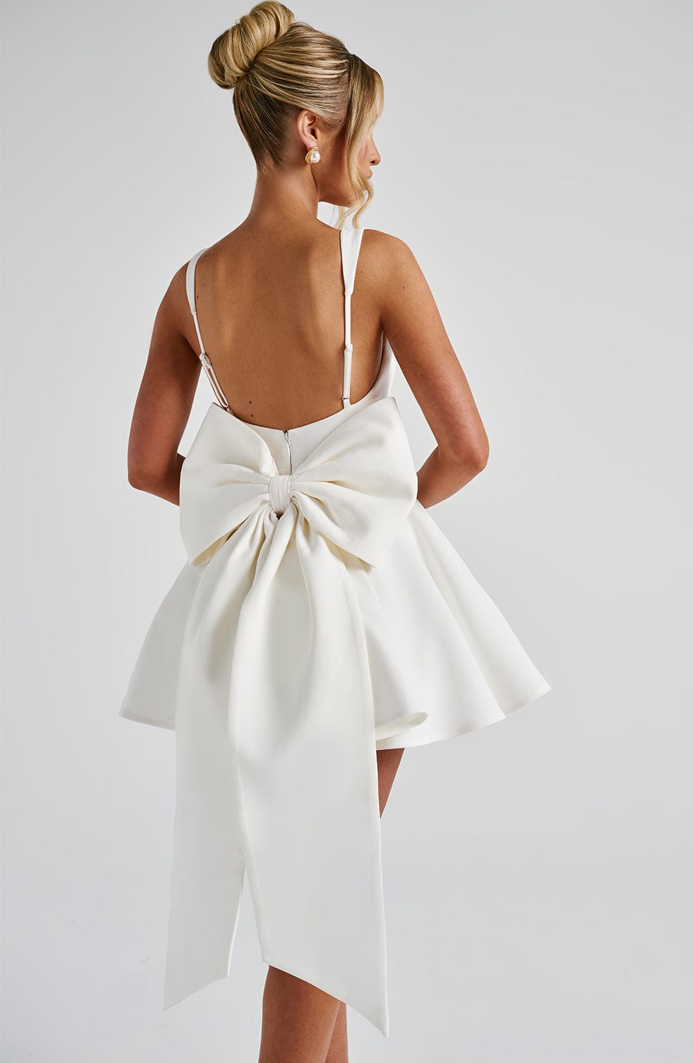 Kristin Back Bow Embellished Mini Dress in Ivory Avalabel